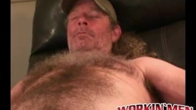 Mature lad with a hairy chest strokes his big hard dong hard