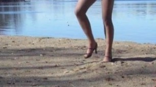 Crossdresser at the lake in hose and heels